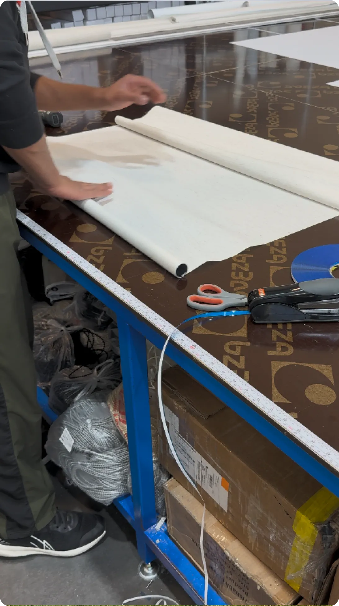 Person working with fabric on table